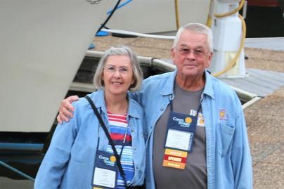 Couple Standing Together With Arms Around One Another